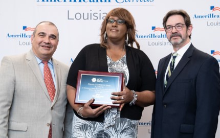 A.J. Farria (center) of AmeriHealth Caritas Louisiana named 2019 winner of ACAP's Making a Difference Award